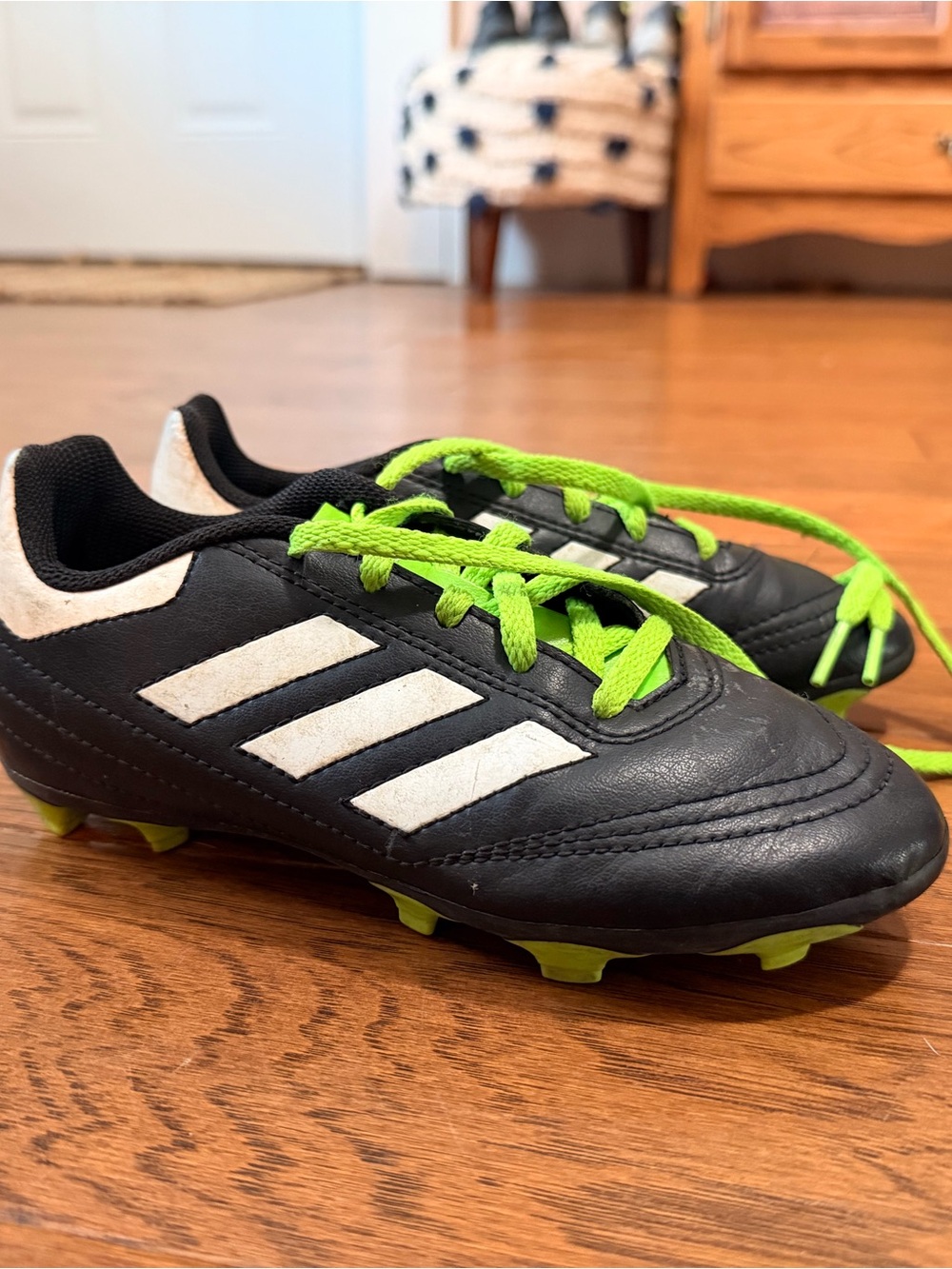 adidas Kids Black Soccer Cleats with White Stripes and Neon Green Laces